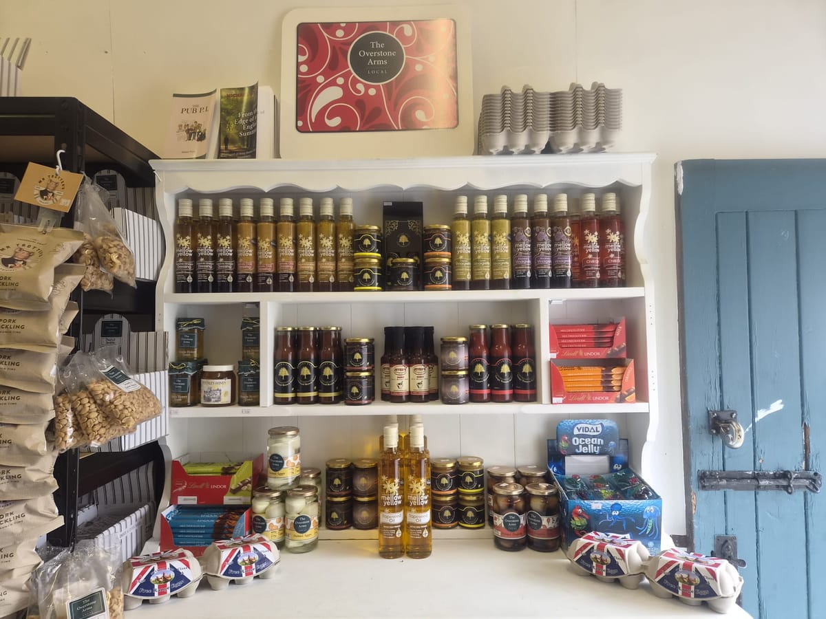 Shelves of oils, dressings, honey and sauces in the village shop