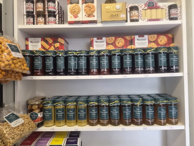 Jars of preserves, marmalades and curds on the shop shelves