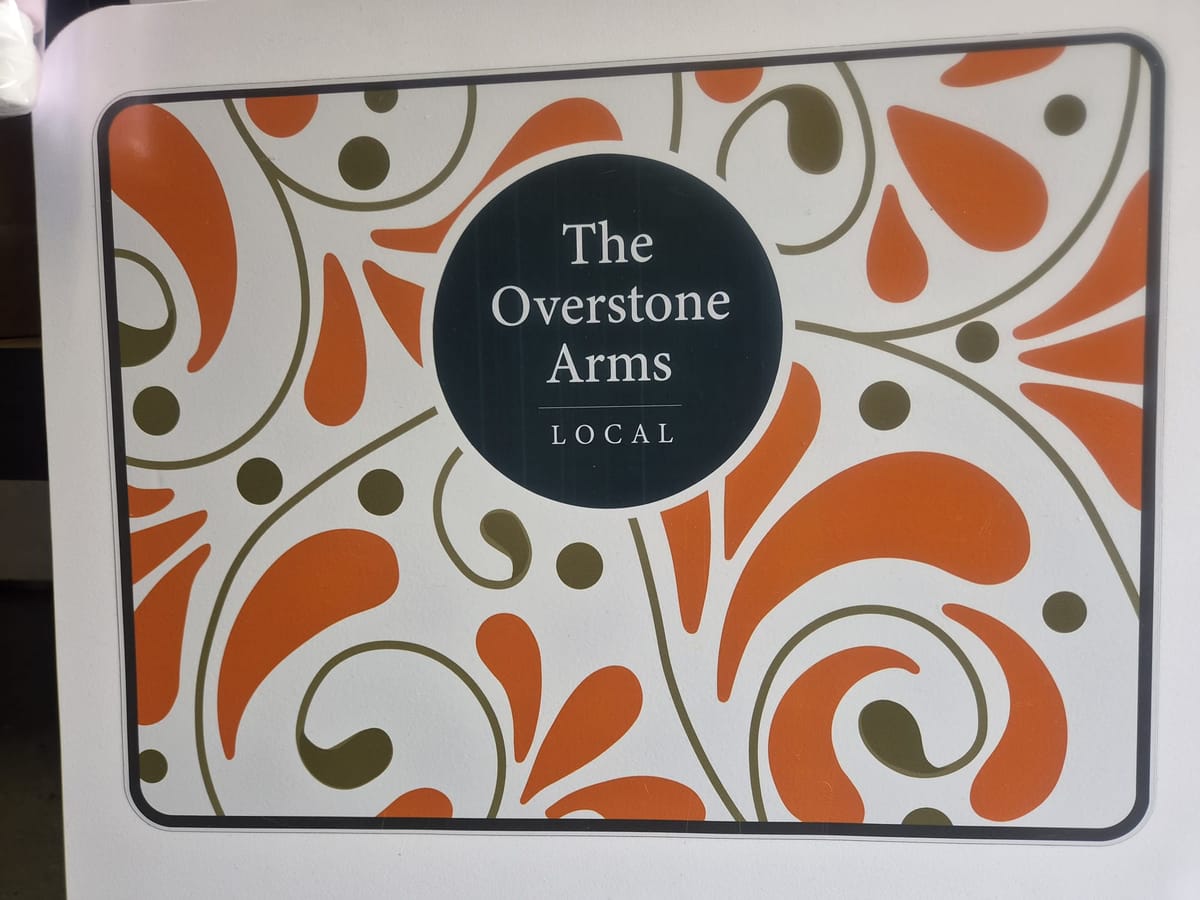 The Overstone Arms Local shop sign