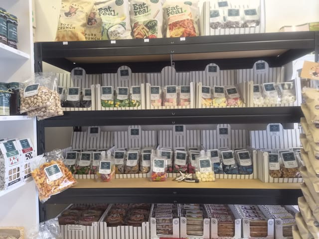 Shelves of sweets, fruity bites and coconut ice in the village shop